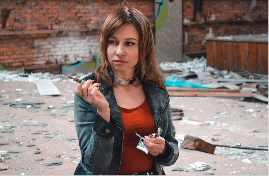 a drug addict injecting drugs